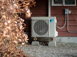 An outdoor heat pump unit installed beside a modern home