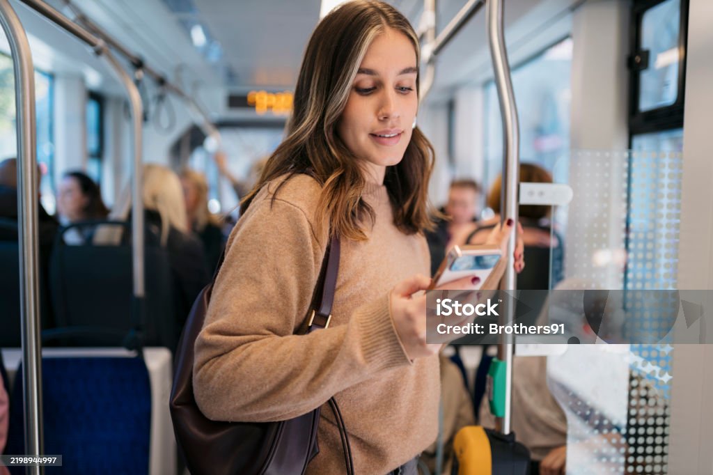 People using public transport to reduce fuel use
